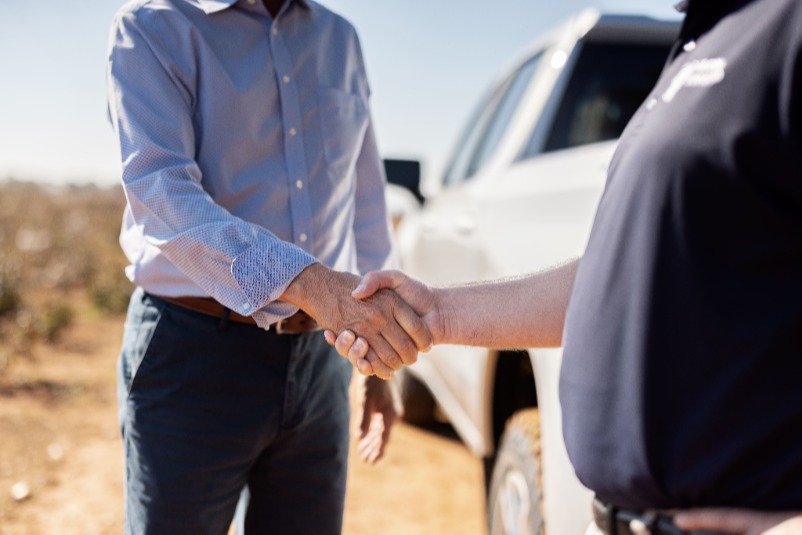 Farm Shield Employee Shaking Hands with Client